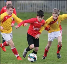  ??  ?? Dylan Lennon (New Ross Celtic) spots a gap and sets off.