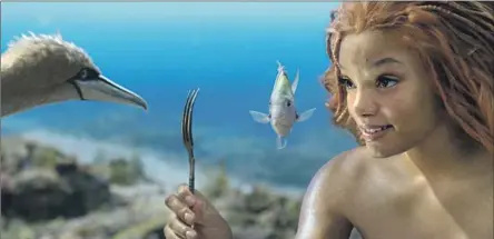  ?? Disney ?? ARIEL (Halle Bailey) shows a find to Scuttle (voiced by Awkwafina) and Flounder (voiced by Jacob Tremblay) in “The Little Mermaid.”