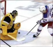  ?? GENE J. PUSKAR - THE ASSOCIATED PRESS ?? New York Rangers’ Chris Kreider (20) cannot get a rebound past Pittsburgh Penguins goaltender Casey DeSmith (1) during the first period of a game in Pittsburgh, Sunday.