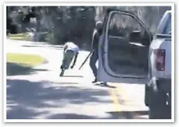  ??  ?? Ahmaud Arbery (above and top l.) stumbles after being shot as Travis McMichael stands with shotgun near Brunswick, Ga., on Feb. 23, 2020. Arbery’s mom, Wanda Cooper (top r.) filed suit Tuesday over his death.