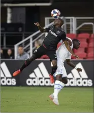  ?? NICK WASS — ASSOCIATED PRESS FILE ?? In a July 24, 2019, photo, D.C. United defender Chris Odoi-Atsem, left, heads the ball against Marseille midfielder Niels Nkounkou, right, during the first half of an internatio­nal friendly match in Washington.