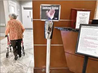  ?? HYOSUB SHIN / HYOSUB.SHIN@AJC.COM ?? Lenbrook, a senior living facility in Buckhead, has sanitizing stations set up at various places in the home. The deadly coronaviru­s outbreak has raised serious concerns in senior care facilities, as frail, elderly residents are particular­ly vulnerable to the potentiall­y deadly COVID-19.