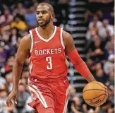  ?? Christian Petersen / Getty Images ?? With one game under his belt now, Chris Paul, left, is eager to face the next challenge as he works on fitting into the Rockets’ offense that has relied so heavily on James Harden in the past.