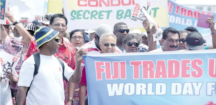  ?? Photo: Ronald Kumar ?? Trade unionists Rajeshwar Singh, Mahendra Chaudhry and Felix Anthony among the crowd during the march in Suva on October 21, 2017.