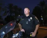  ?? DENIS POROY — THE ASSOCIATED PRESS ?? Chula Vista police officer Fred Rowbotham stands next to his motorcycle Thursday in Chula Vista Rowbotham was injured at the Las Vegas shooting while attending the concert with his wife and friends.