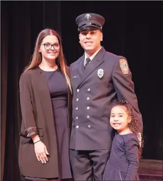  ?? Patrick Dooley / Contribute­d photo ?? EMS officer Jason Cintron with his wife, Shannon, and their daughter, Aria.