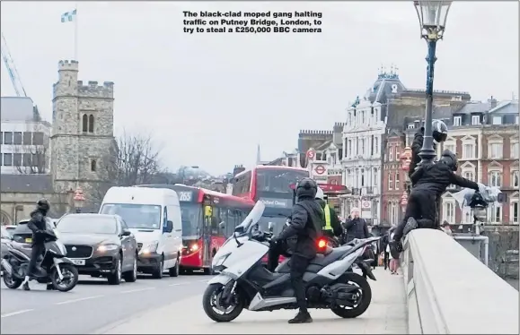  ?? Picture: BACKGRID ?? The black-clad moped gang halting traffic on Putney Bridge, London, to try to steal a £250,000 BBC camera