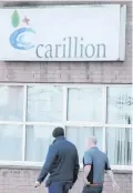  ??  ?? Staff arrive at Carillion’s offices in Belfast’s Titanic Quarter yesterday