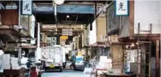  ??  ?? A fishmonger cleans his shop at the Tsukiji fish market in Tokyo yesterday, the first day of relocation to the new Toyosu market following Tsukiji’s final tuna auction. —AFP