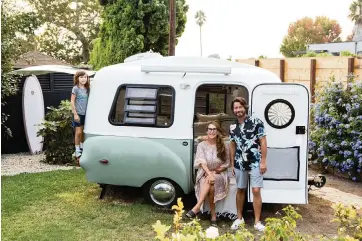  ?? BETH COLLER NYT ?? Stacie Krajchir-Tom, with her husband, Kristopher, and her son, Milo, in California.