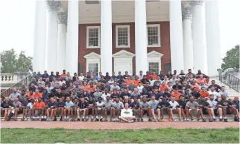  ?? MATT RILEY, UVA MEDIA RELATIONS ?? On Monday, the football players took a team photo at The Rotunda, with arms locked in unity.