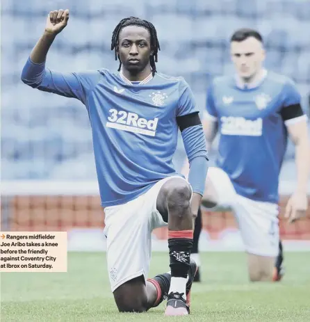  ??  ?? 3 Rangers midfielder Joe Aribo takes a knee before the friendly against Coventry City at Ibrox on Saturday.