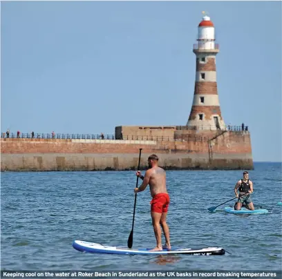  ?? ?? Keeping cool on the water at Roker Beach in Sunderland as the UK basks in record breaking temperatur­es