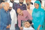  ?? HT PHOTO ?? Health minister Brahm Mohindra (left) inaugurati­ng the vaccinatio­n campaign at Faridkot on Tuesday.