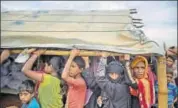  ?? AP ?? Rohingya Muslims wait in a queue to receive aid.