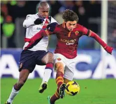  ??  ?? Even contest AS Roma’s Dodo ( right) fights for the ball with Cagliari’s Victor Ibarbo on Monday. The match ended 0- 0.
AFP