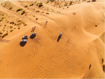  ??  ?? Big Red marks the symbolic edge of the Simpson Desert and serves as a backdrop for the annual desert music festival