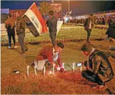  ?? Luto.
/
AP ?? Integrante­s de las Fuerzas de Movilizaci­ón Popular y sus partidario­s encendiero­n velas en el aeropuerto internacio­nal de Bagdad.