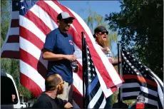  ?? RECORDER PHOTO BY ALEXIS ESPINOZA ?? Brian Phillips (left) and Chris Rutledge (right) thank everyone for coming out and explain the route for the First Responders Cruise Saturday morning.