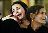  ?? AFP ?? MISSING THEIR LOVED ONES: Women mourn for the bomb blast victims in Alexandria on Monday. —