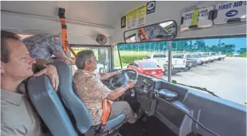  ?? RICK CRUZ, PACIFIC DAILY NEWS ?? Gov. Eddie Calvo takes a drive around Adelup Park in a school bus with a security camera.