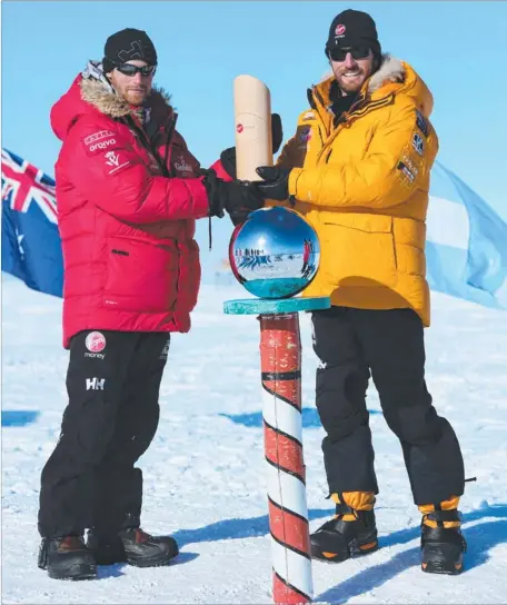  ?? Picture: AP/WALKING WITH THE WOUNDED ?? Fourth-in-line to the throne Prince Harry and Aussie Heath Jamieson pose for a happy snap at the South Pole after completing the two-week 335km trek