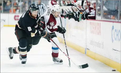  ??  ?? Teemu Selanne #8 of the Anaheim Ducks and Stefan Elliott #46 of the Colorado Avalanche race for the puck in the third period at Honda Center on Feb 24, in Anaheim, California. The Ducks defeated the Avalanche 4-3 in overtime. (AFP)