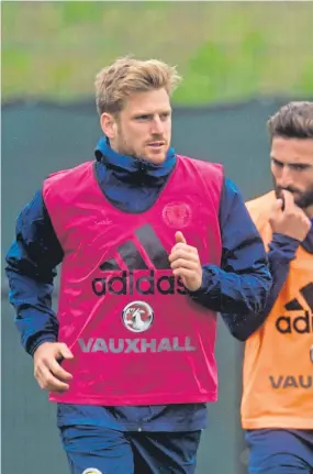  ?? Pictures: SNS/ DC Thomson. ?? Above: Stuart Armstrong and John Souttar at training with Scotland this week; right: Souttar, Ryan Dow, Gavin Gunning and Ryan Gauld watch Armstrong being put through his paces during training with Dundee United in January 2014; left: the United contingent bound for the 1986 World Cup, from left – Paul Sturrock, Maurice Malpas, Eamonn Bannon and Dave Narey.