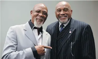  ?? — THE ASSOCIATED PRESS ?? John Carlos, left, and Tommie Smith voiced their support for Colin Kaepernick and other athletes staging national anthem protests, 48 years after they raised their gloved fists on the medals stand in a symbolic protest at the Olympics.
