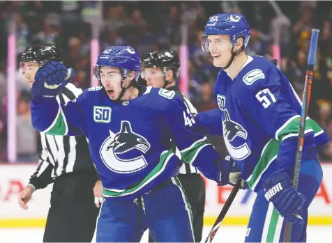  ?? — GETTY IMAGES ?? The skill sets of defenceman Quinn Hughes, left —who potted his first goal on Wednesday at Rogers Arena — and the puck-moving capabiliti­es of blue-liner teammate Tyler Myers are positive signs for the Canucks.