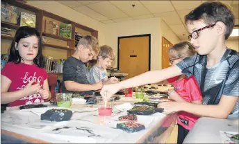  ?? ADAM MACINNIS/THE NEWS ?? Grade 2 students at Trenton Elementary were busy this past week painting rocks in honour of veterans who have served to protect Canada. Clockwise from left are: Tatum MacKenzie, James Cameron, Hayden Richard, Callie Caldwell and Evan Affleck.