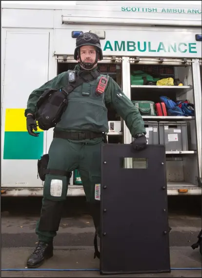  ??  ?? A paramedic in a ballistics suit with a ceramic plate shield, and other equipment, from top right, including off-road vehicles