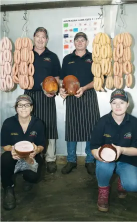  ??  ?? Garfield Country Style Meats celebrate winning a record five gold medals for sausage and ham products at the AMIC South East Victoria awards. The staff are (from left) Pauline Cooban, John Preston, Wayne Claridge and Kathy Turner.