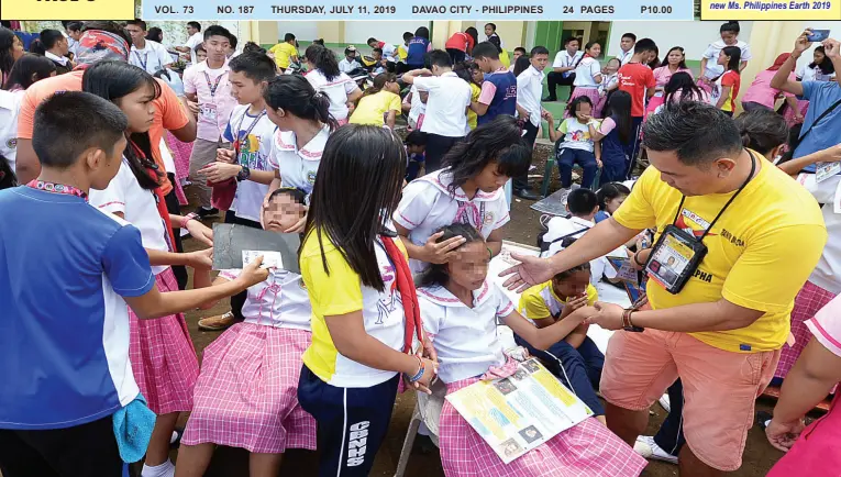  ??  ?? RESCUERS and school first aid responders attend to the students of Crossing Bayabas National High School in Toril District after experienci­ng anxiety attacks due to the aftershock on Wednesday morning. BING GONZALES