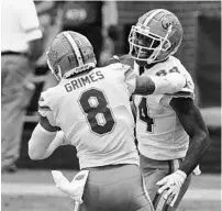  ?? THOMAS GRANING/AP ?? Florida tight end Kyle Pitts (84) and wide receiver Trevon Grimes (8) celebrate after Pitts scored a touchdown against Ole Miss in Oxford, Miss., Saturday.