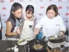  ??  ?? CHEF Florabel Co-Yatco shows guests how to cook tortang talong using Quorn during the launch of World Meat Free Day.