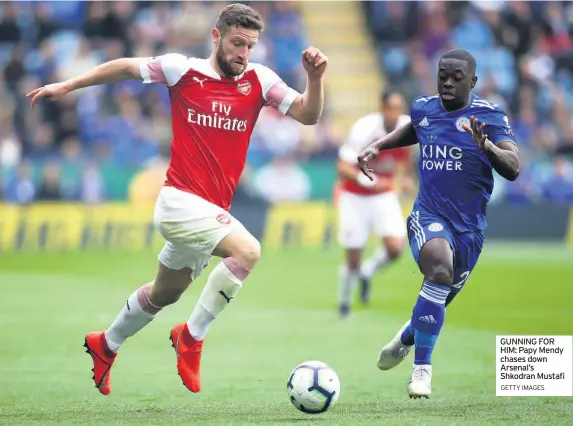  ?? GETTY IMAGES ?? GUNNING FOR HIM: Papy Mendy chases down Arsenal’s Shkodran Mustafi