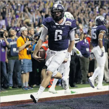  ?? — GETTY IMAGES ?? Bram Kohlhausen of the TCU Horned Frogs runs for the game winning touchdown in the third overtime against the Oregon Ducks during the Alamo Bowl on Saturday night in San Antonio.