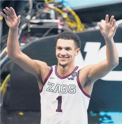  ?? DARRON CUMMINGS/AP ?? Gonzaga’s Jalen Suggs (1) celebrates after making the winning shot against UCLA in overtime Saturday in Indianapol­is.