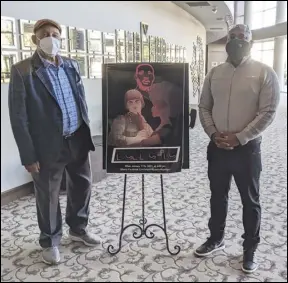  ?? JULIE DRAKE/VALLEY PRESS ?? Bishop Henry Hearns (left) and Nigel Holly stand next to a poster drawn by Antelope Valley High School senior Angela Cuevas for “Eclectic,” this year’s student produced play for the 21st annual Justice Sunday.