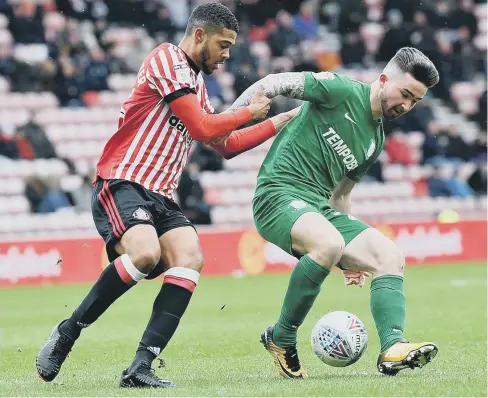  ??  ?? Preston striker Sean Maguire, here keeping Sunderland defender Jake Clarke-Salter at bay, has proved to be a fine signing from the League of Ireland.