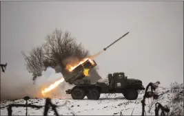  ?? VADIM GHIRDA — THE ASSOCIATED PRESS ?? The Ukrainian military fires from a multiple rocket launcher at Russian positions in the Kharkiv area, Ukraine, on Saturday.