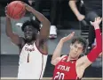  ?? JOHN LOCHER — THE ASSOCIATED PRESS ?? USC’s Chevez Goodwin, left, grabs a rebound in front of Utah’s Mikael Jantunen during the first half.