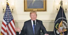  ?? (AFP) ?? Donald Trump speaks about the Iran deal from the White House, on Friday, during which he backed away from designatin­g Iran’s Revolution­ary Guards as a terror group