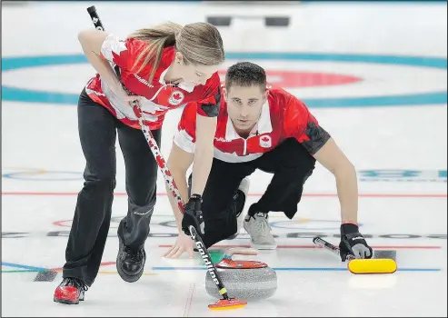  ?? AARON FAVILA/AP ?? Canada’s Kaitlyn Lawes (left) sweeps the ice as John Morris shouts instructio­ns during their mixed doubles semifinal match against Norway on Monday. Canada plays Switzerlan­d for gold early this morning.