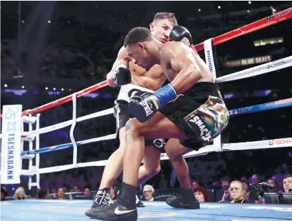  ?? AP FOTO ?? CRUCIAL ROUND. Gennady Golovkin sends Danny Jacobs down in the fourth.