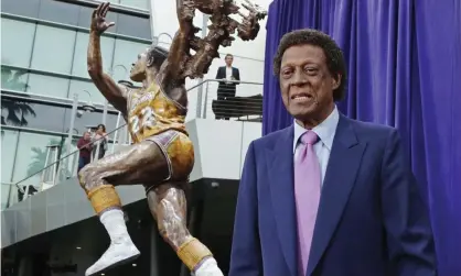  ?? Photograph: Reed Saxon/AP ?? Elgin Baylor stands next to a statue honoring his Lakers career in 2018.