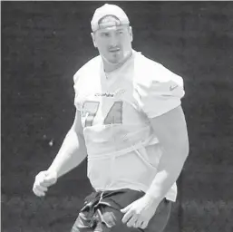  ?? AMY BETH BENNETT/SOUTH FLORIDA SUN SENTINEL ?? Miami Dolphins tackle Liam Eichenberg runs drills during practice at the Baptist Health Training Facility in Davie on May 26.