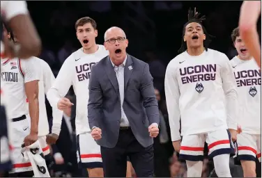  ?? Associated Press ?? Gasket blown: UCONN COACH DAN HURLEy AND PLAyERS REACT DURING THE fiRST HALF AGAINST ST. JOHN'S IN THE SEMIfiNALS OF THE BIG EAST MEN'S TOURNAMENT FRIDAy IN NEw YORK.