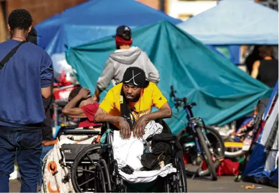  ?? JOHN TLUMACKI/GLOBE STAFF ?? Many in the city trace the origins of the crisis at Mass. and Cass to the sudden closing of the Long Island Bridge and the evacuation of the island’s homeless facility in 2014.